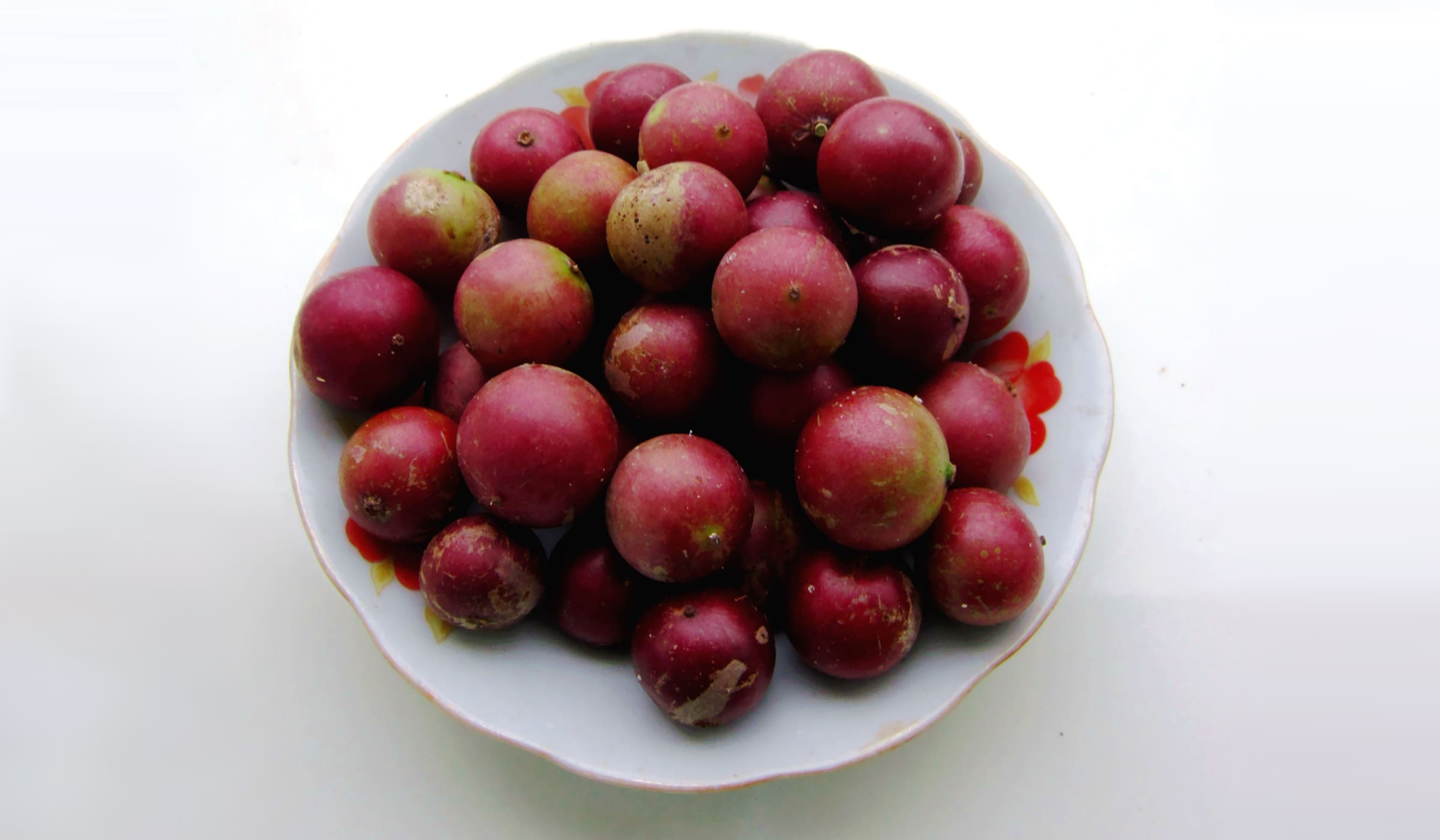 Coffee plums in a cup