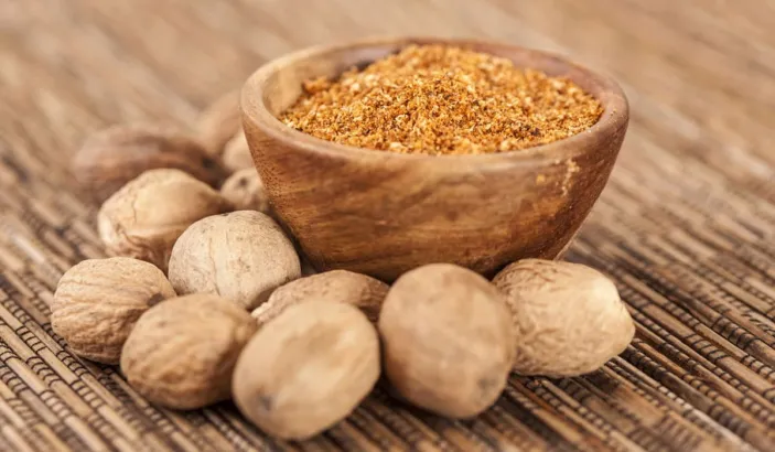 Nutmeg with nutmeg powder
